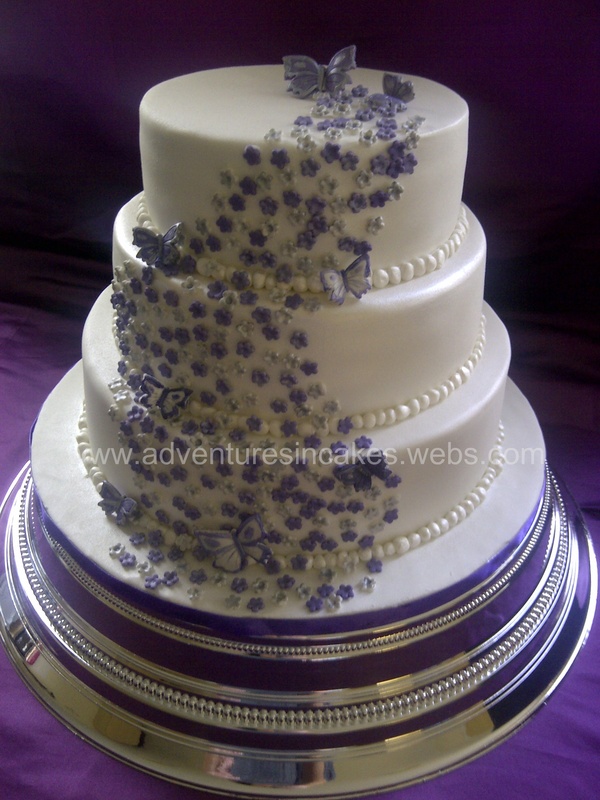 Purple and Silver Wedding Cakes with Flowers