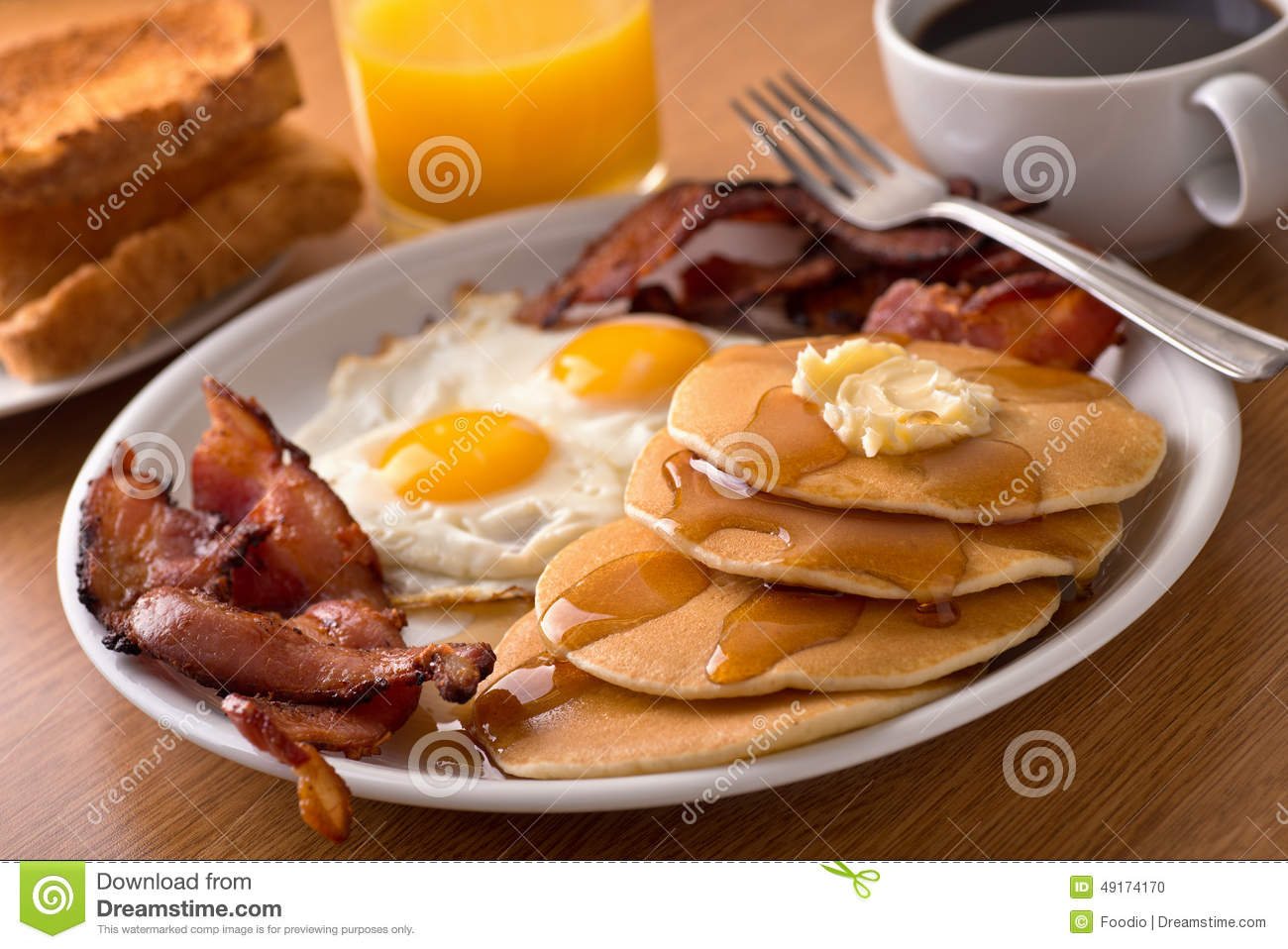 Orange Juice Pancakes Sausage Eggs and Bacon