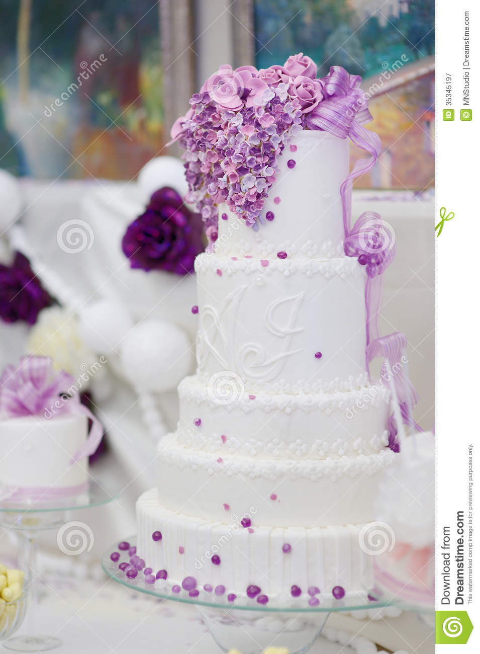 White Wedding Cake with Purple Flowers