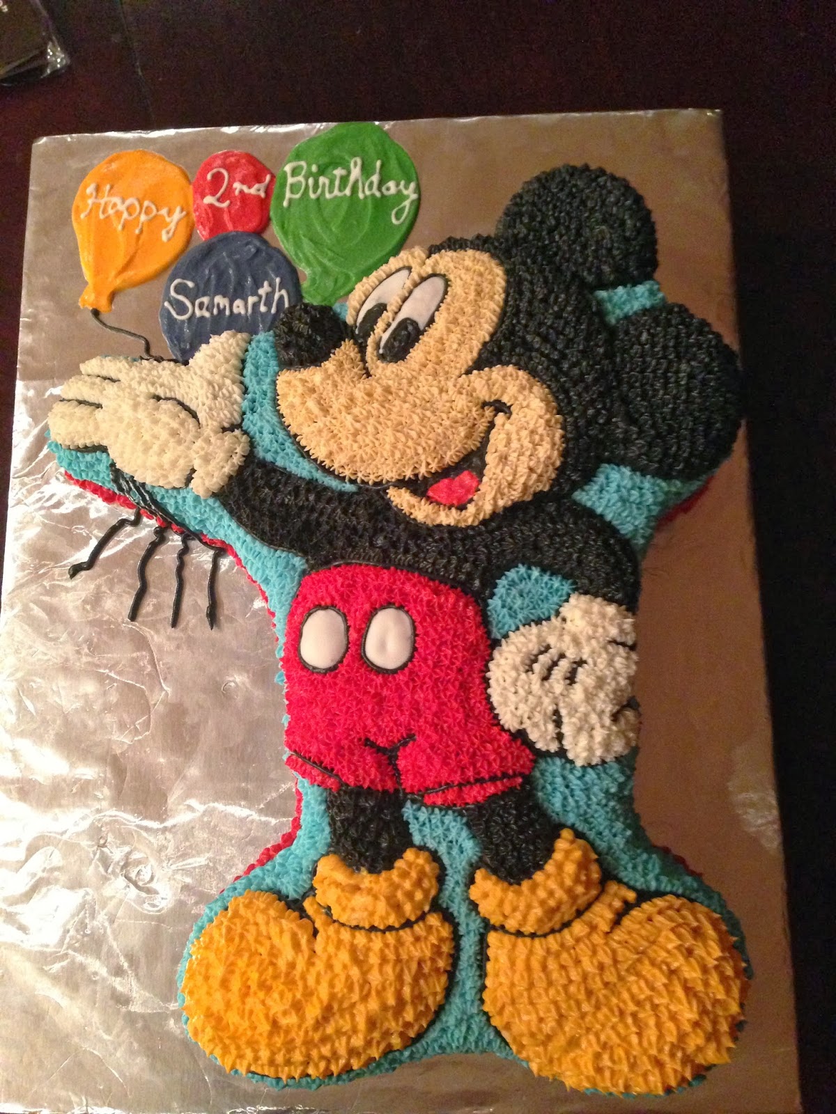 Mickey Mouse Holding Birthday Cake