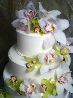 White Buttercream Wedding Cake with Orchids