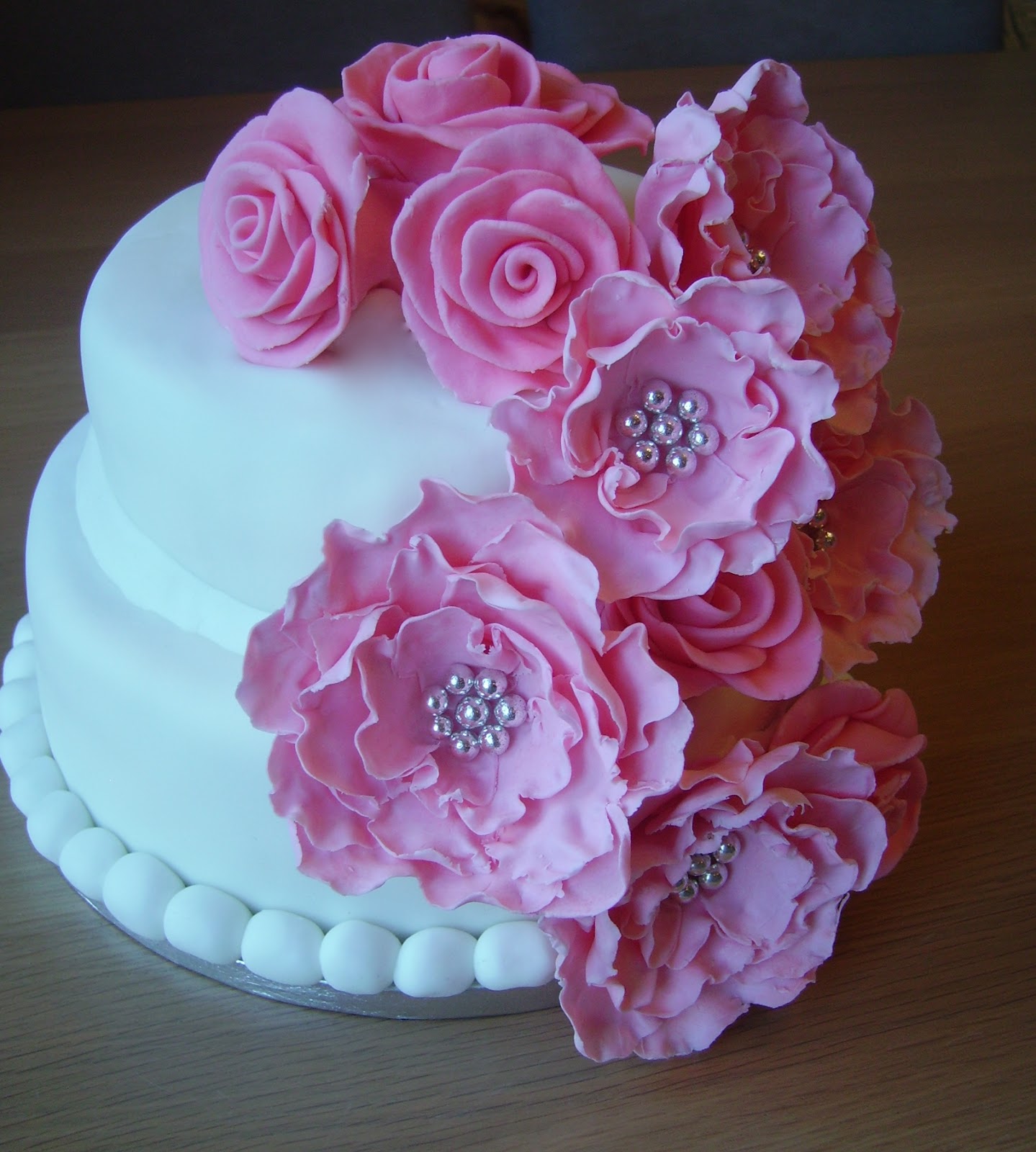 Pink and White Birthday Cakes with Flowers