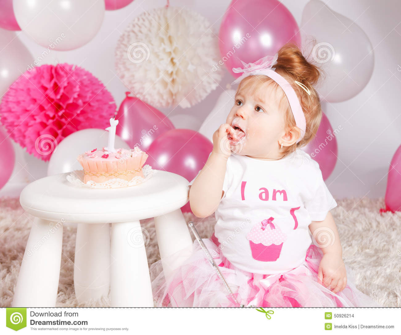 Baby Eating Birthday Cake