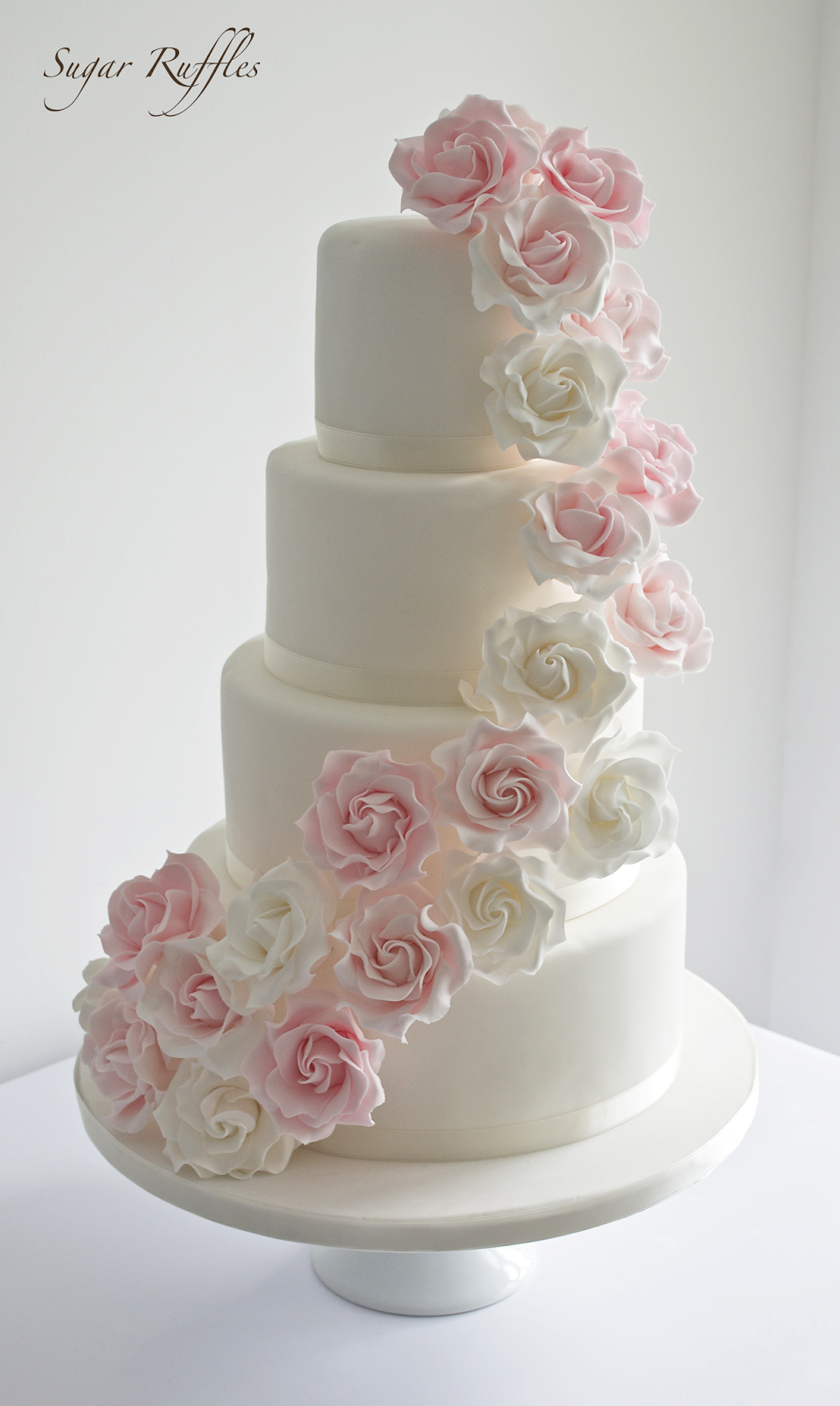 White Wedding Cake with Pink Roses