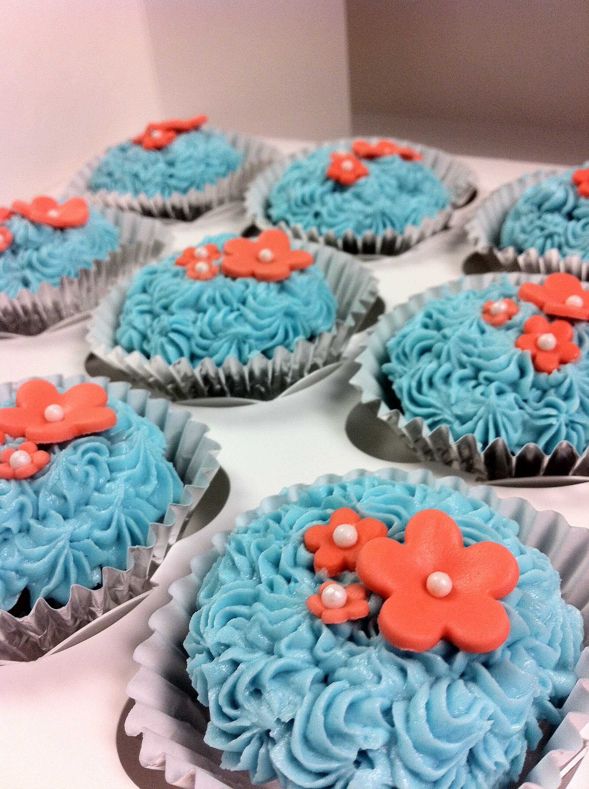 10 Photos of Coral And Teal Baby Shower Cupcakes