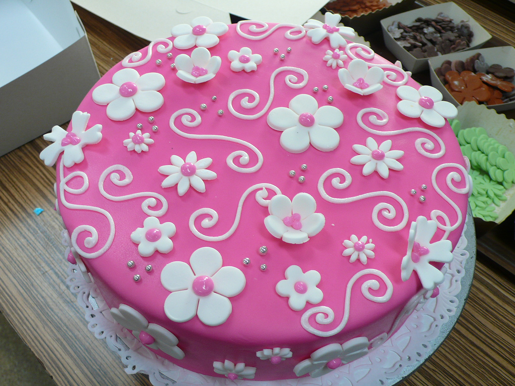 Pink Birthday Cake with White Flowers