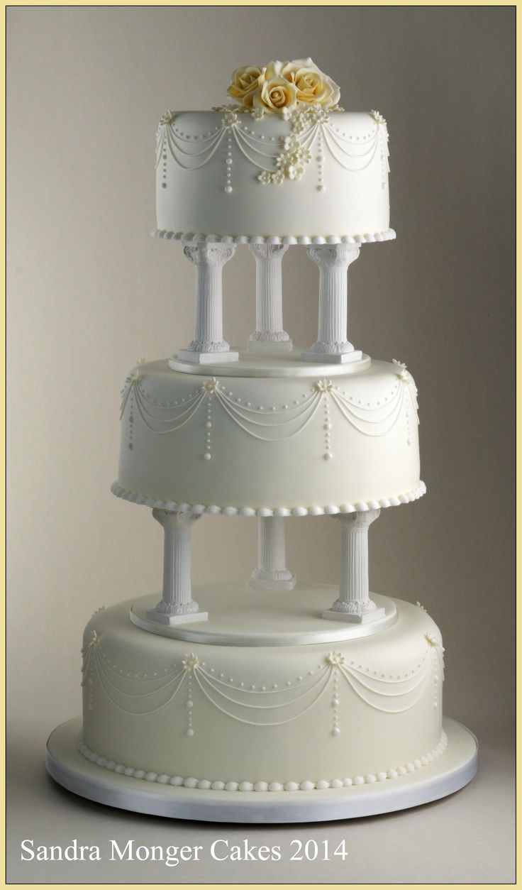 Wedding Cake with Pillars and Flowers