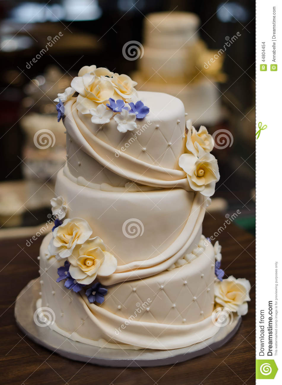 Purple and Yellow Wedding Cake with Flowers