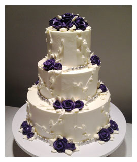 Buttercream Wedding Cake with Purple Flowers