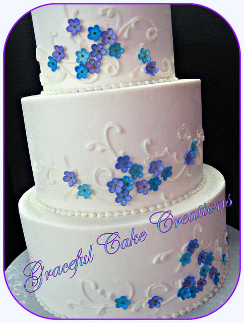 Buttercream Wedding Cake with Purple Flowers