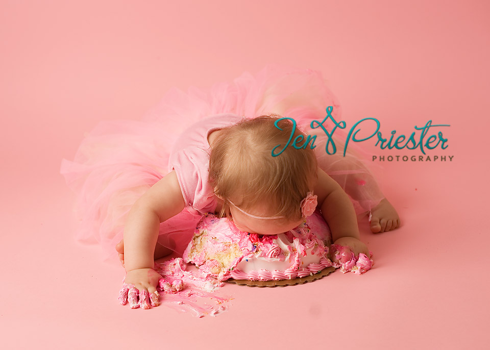 Baby Eating First Birthday Cake