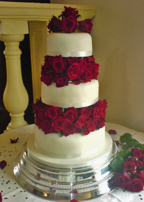 Tiered Wedding Cake with Fresh Roses Between Layers