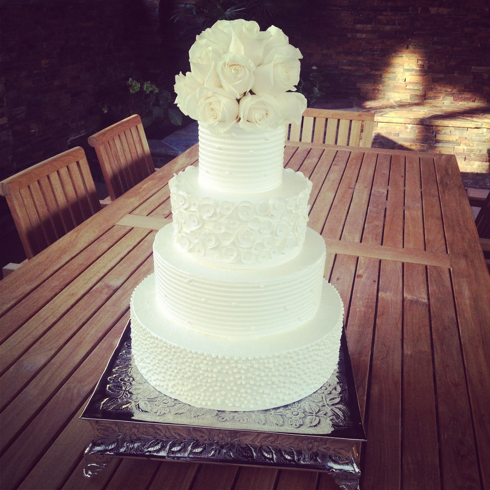 White Buttercream Wedding Cake with Roses