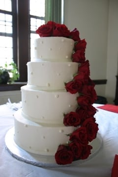 White Buttercream Wedding Cake with Red Roses