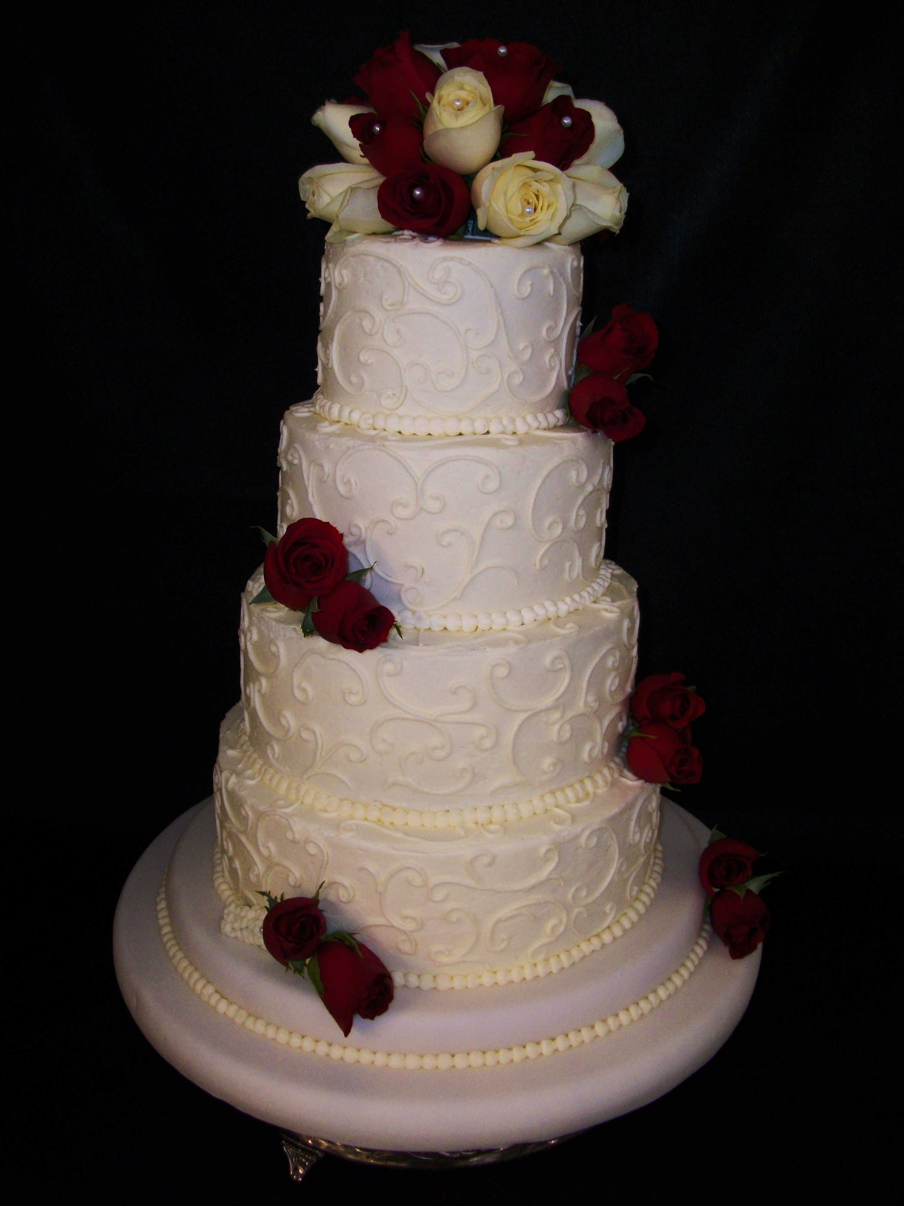 White Buttercream Wedding Cake with Red Roses