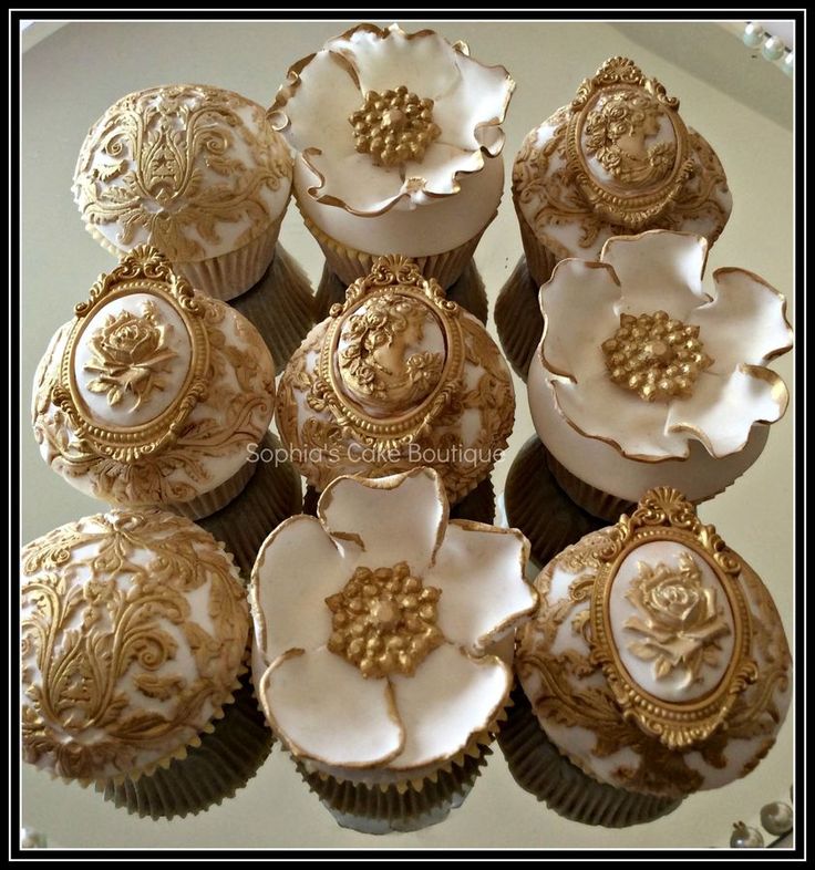 Gold and Ivory Wedding Cake with Cupcakes