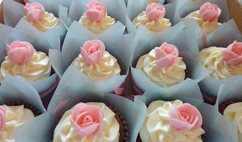 Vanilla Cupcake with Frosting and Pink Rose