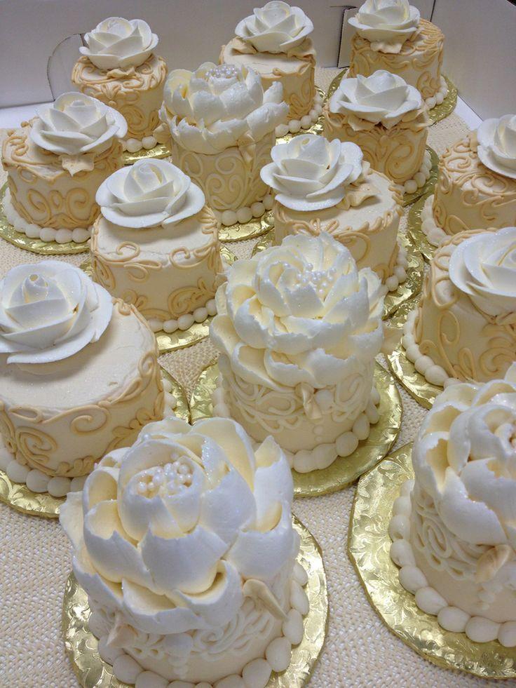 White and Gold Wedding Cake with Cupcakes