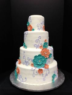 Teal and Coral Wedding Cake with White Flowers