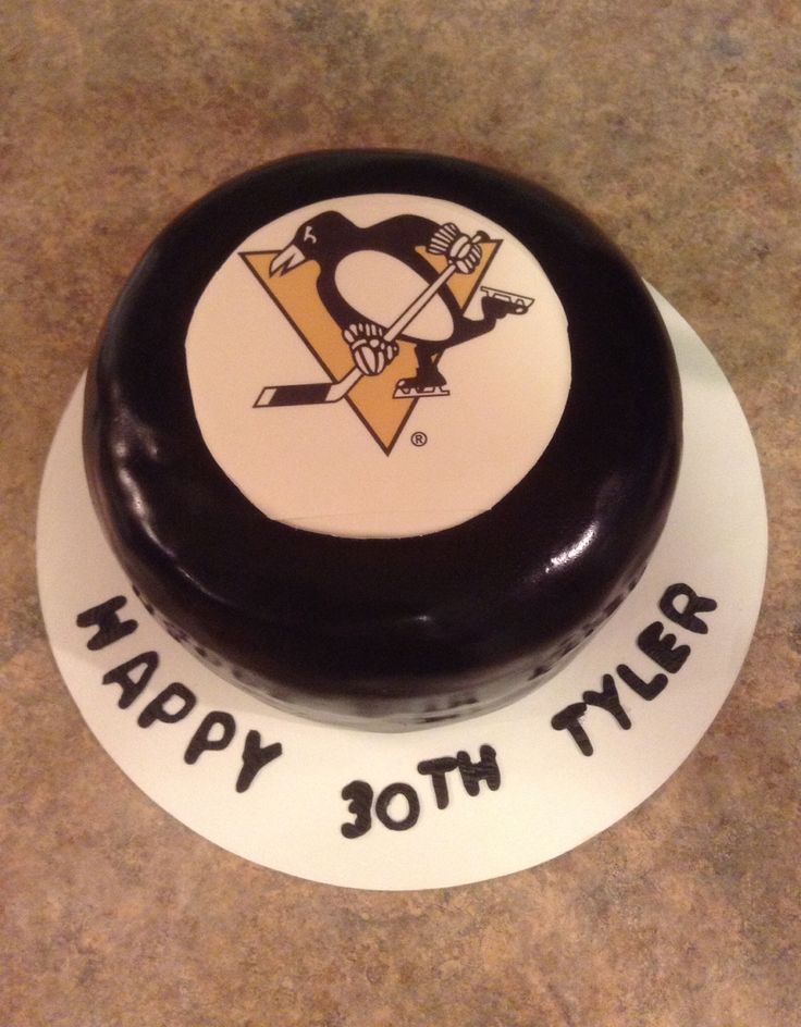 Penguins Hockey Puck Cake