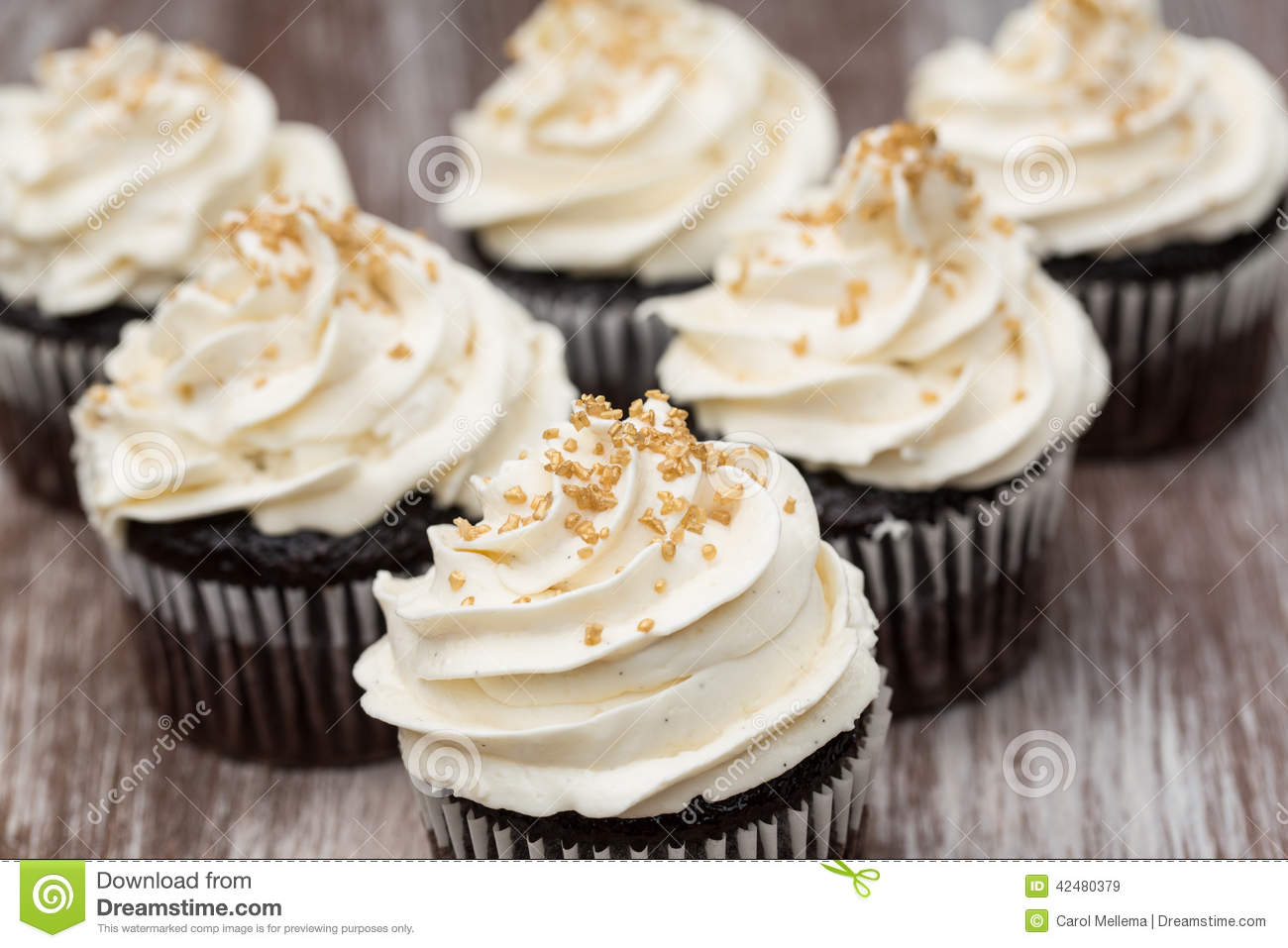 White Chocolate Cupcakes with Frosting and Sprinkles