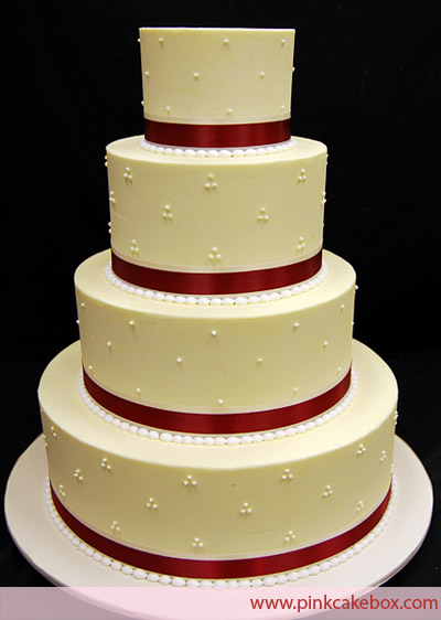 7 Photos of 4 Tiered Wedding Cakes With Ribbon