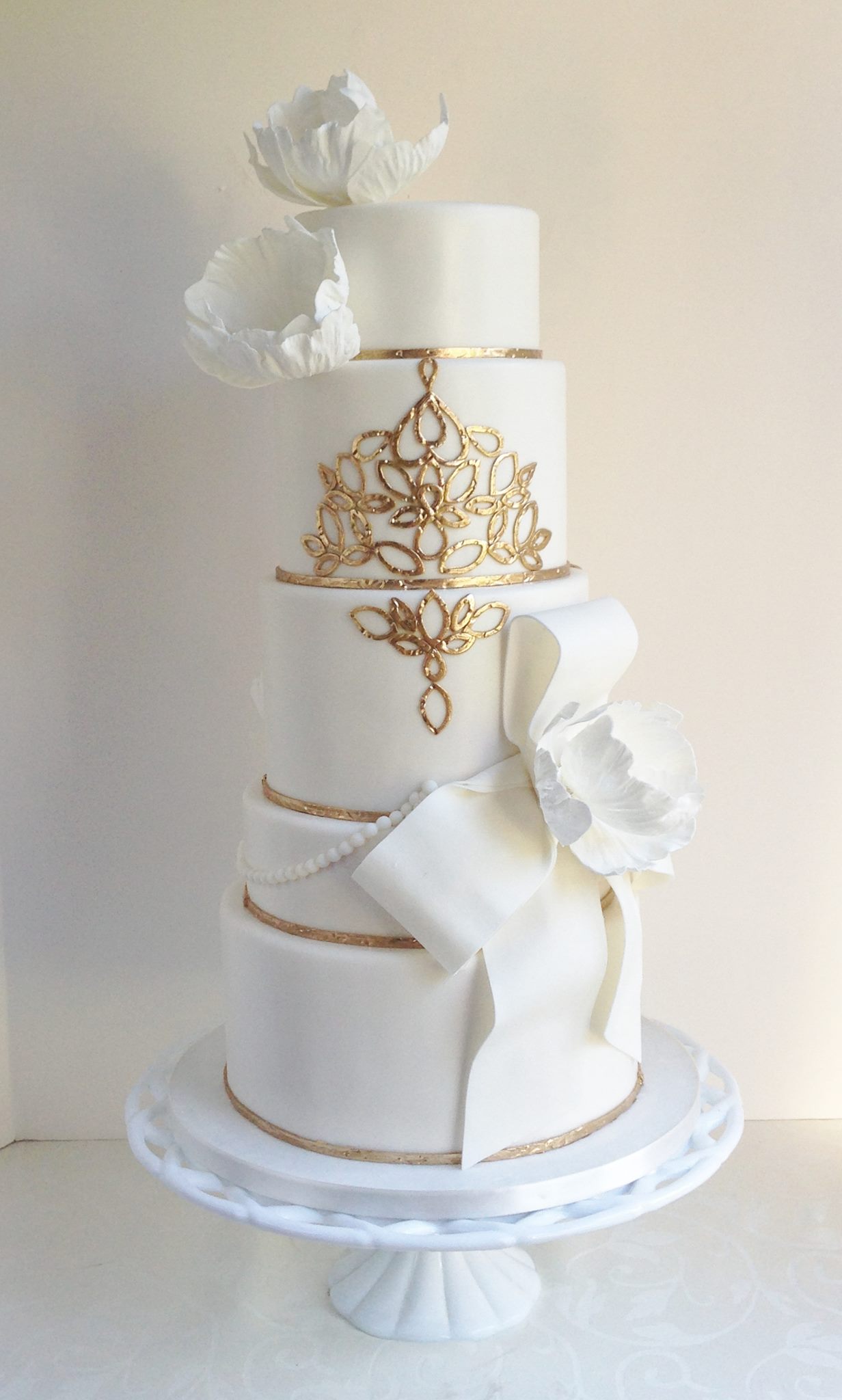 Elegant Gold and White Wedding Cake