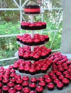 Pink Black and White Wedding Cake with Cupcakes