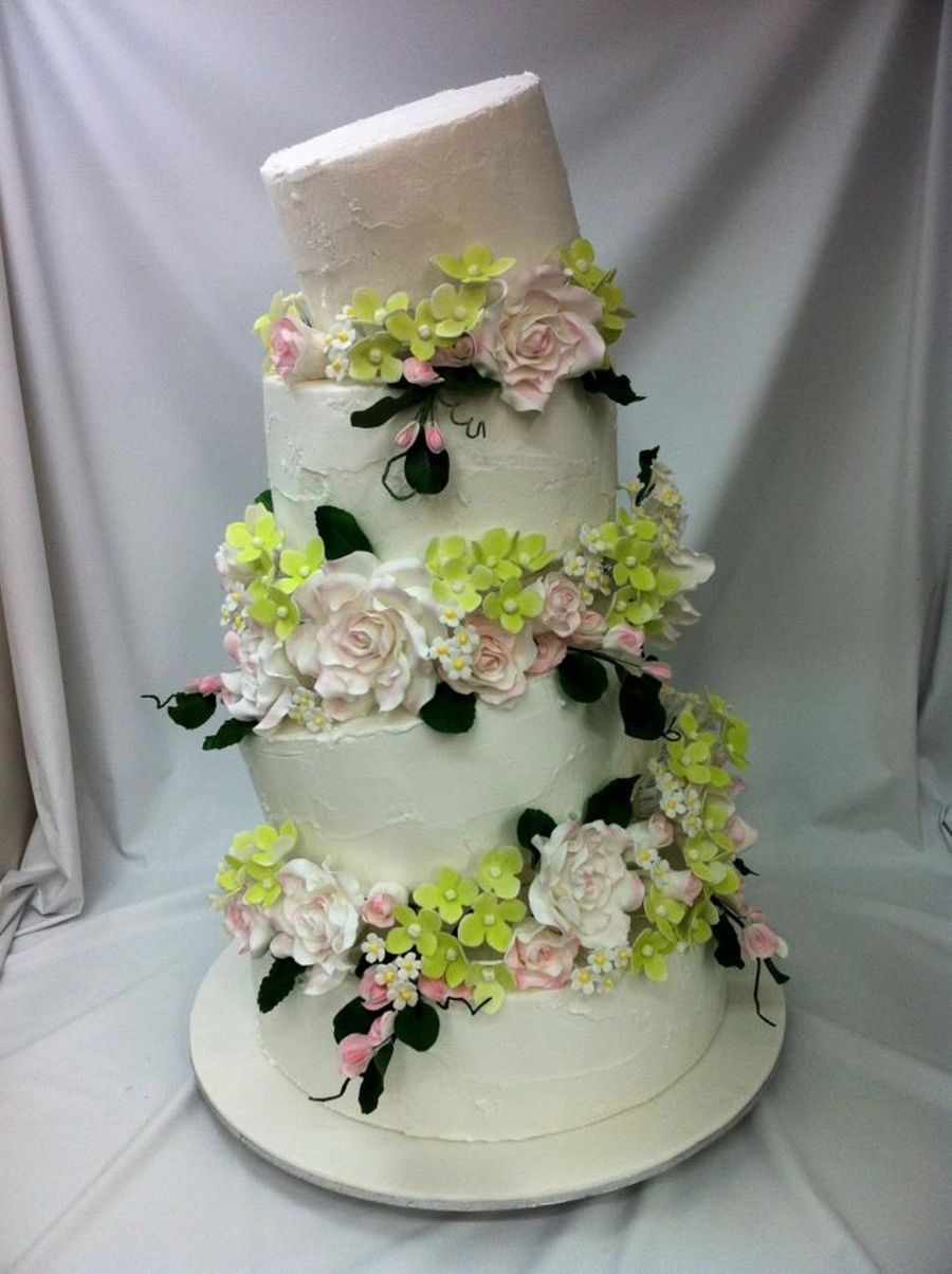 Wedding Cake with Flowers Between Tiers